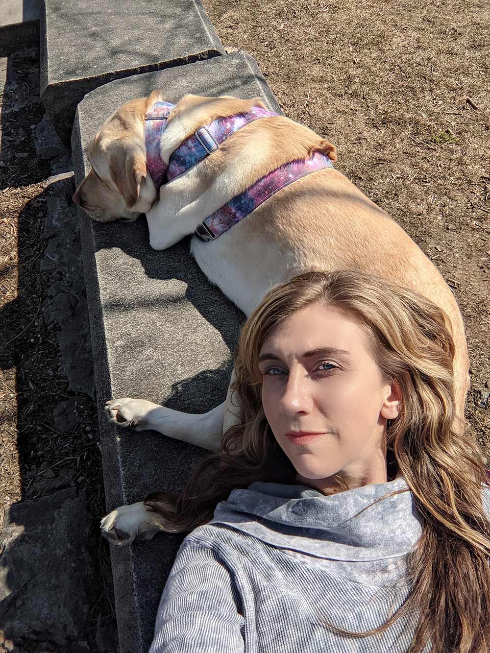 Headshot of Reiki Master Erica Harmon with her dog, Momo